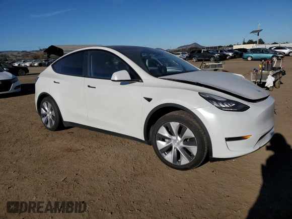 2020 Tesla Model Y Long Range with VIN 5YJYGDEE4LF015455, listed as a Copart auction lot 84223984 with 77,398 mi miles and Salvage Title. Bid and sale history available at DreamBid. Image 4.