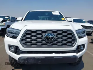 2023 Toyota Tacoma SR with VIN 3TMCZ5AN7PM630874, listed as a IAAI auction lot 40298041 with 8,635 mi miles and . Bid and sale history available at DreamBid. Image 12.