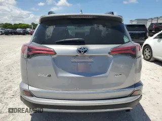 2018 Toyota RAV4 XLE with VIN 2T3WFREV7JW423768, listed as a Copart auction lot 61841875 with 111,991 mi miles and Salvage title. Bid and sale history available at DreamBid. Image 6.