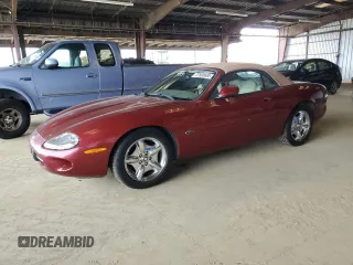 1999 Jaguar XK with VIN SAJGX2049XC041214, listed as a Copart auction lot 47800695 with 83,897 mi miles and Clean Title. Bid and sale history available at DreamBid. Image 1.