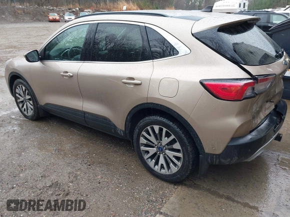 2021 Ford Escape Titanium Hybrid with VIN 1FMCU9DZXMUA66161, listed as a IAAI auction lot 41208651 with 61,198 mi miles and . Bid and sale history available at DreamBid. Image 3.