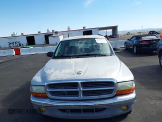 2003 Dodge Dakota SLT with VIN 1D7HL48N33S295059, listed as a IAAI auction lot 42085612 with 176,934 mi miles. Bid and sale history available at carsss.com. Image 6.