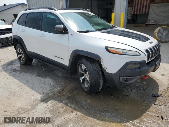 2015 Jeep Cherokee Trailhawk with VIN 1C4PJMBS8FW717950, listed as a Copart auction lot 60321625 with 155,210 mi miles and Salvage title. Bid and sale history available at DreamBid. Image 4.