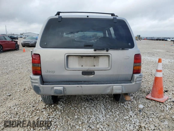 1998 Jeep Grand Cherokee with VIN 1J4FX48S6WC345358, listed as a Copart auction lot 85057454 with Not provided miles and Salvage title. Bid and sale history available at DreamBid. Image 6.