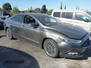 2017 Ford Fusion Titanium z VIN 3FA6P0SU5HR105477, wystawiony jako IAAI lot #41072696 z przebiegiem 92 926 mil mil oraz . Historia ofert i sprzedaży dostępna na DreamBid. Obrazek 13.