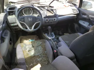 2016 Honda Fit LX z VIN JHMGK5H59GX027526, wystawiony jako Copart lot #57831785 z przebiegiem Nie podano mil oraz Szkoda całkowita • Salvage title. Historia ofert i sprzedaży dostępna na DreamBid. Obrazek 8.