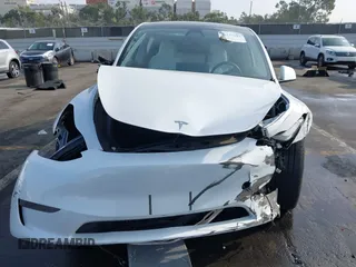 2023 Tesla Model Y Long Range with VIN 7SAYGDEE3PF900030, listed as a IAAI auction lot 41147192 with 13,903 mi miles and . Bid and sale history available at DreamBid. Image 11.