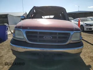 2000 Ford F-150 XL with VIN 1FTZX1728YNA87502, listed as a Copart auction lot 54870295 with 219,971 mi miles and Salvage title. Bid and sale history available at DreamBid. Image 5.