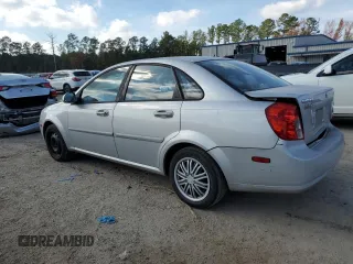 2006 Suzuki Forenza z VIN KL5JD56Z66K299816, wystawiony jako Copart lot #81893914 z przebiegiem 156 416 mil mil oraz Szkoda całkowita • Salvage title. Historia ofert i sprzedaży dostępna na DreamBid. Obrazek 2.