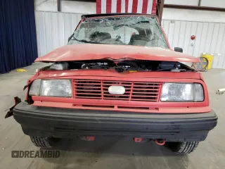 1994 Geo Tracker z VIN 2CNBE18U3R6952403, wystawiony jako Copart lot #79038524 z przebiegiem 271 461 mil mil oraz Szkody całkowita. Historia ofert i sprzedaży dostępna na DreamBid. Obrazek 5.