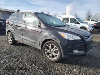 2016 Ford Escape Titanium with VIN 1FMCU0J9XGUA30359, listed as a Copart auction lot 89178985 with 148,718 mi miles and Salvage Title. Bid and sale history available at carsss.com. Image 4.