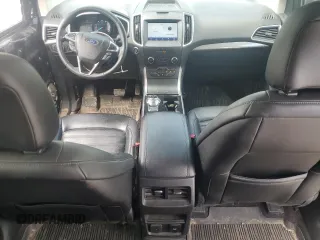 2020 Ford Edge SEL z VIN 2FMPK4J95LBB04706, wystawiony jako Copart lot #56948215 z przebiegiem 69 376 mil mil oraz Czysty tytuł • Clean title. Historia ofert i sprzedaży dostępna na DreamBid. Obrazek 8.