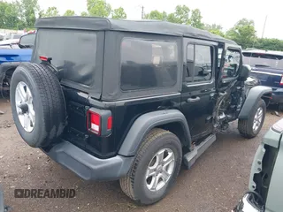 2018 Jeep Wrangler Unlimited Sport S with VIN 1C4HJXDG3JW150232, listed as a IAAI auction lot 42379385 with 60,679 mi miles and . Bid and sale history available at DreamBid. Image 4.