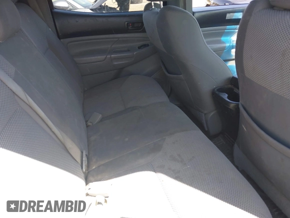 2014 Toyota Tacoma with VIN 3TMLU4EN4EM154261, listed as a IAAI auction lot 42119237 with 211,929 mi miles and . Bid and sale history available at DreamBid. Image 8.