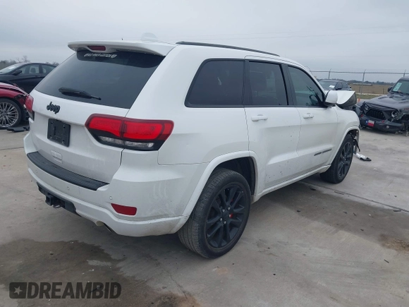 2018 Jeep Grand Cherokee Laredo E with VIN 1C4RJEAG0JC218694, listed as a IAAI auction lot 41587665 with 97,618 mi miles. Bid and sale history available at carsss.com. Image 4.