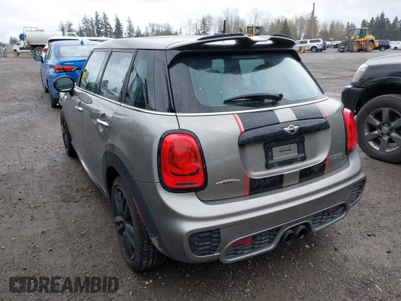 2017 MINI Hardtop 4 Door Cooper S z VIN WMWXU3C58H2D33073, wystawiony jako IAAI lot #41913081 z przebiegiem 51 631 mil mil oraz . Historia ofert i sprzedaży dostępna na DreamBid. Obrazek 3.