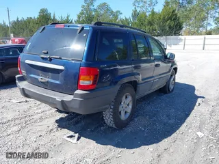 2001 Jeep Grand Cherokee Laredo with VIN 1J4GW48S91C721227, listed as a IAAI auction lot 41792524 with 229,973 mi miles. Bid and sale history available at carsss.com. Image 4.