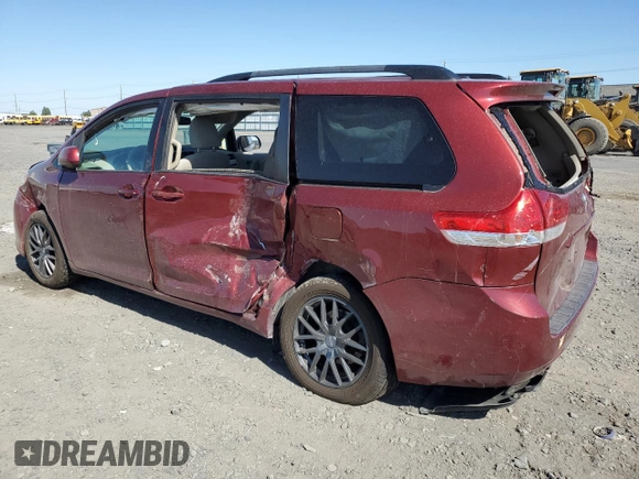 2014 Toyota Sienna LE with VIN 5TDJK3DC5ES093932, listed as a Copart auction lot 63611985 with 142,044 mi miles and Salvage title. Bid and sale history available at DreamBid. Image 2.