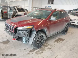 2016 Jeep Cherokee Trailhawk with VIN 1C4PJMBBXGW135138, listed as a IAAI auction lot 41595718 with 267,058 mi miles. Bid and sale history available at carsss.com. Image 19.