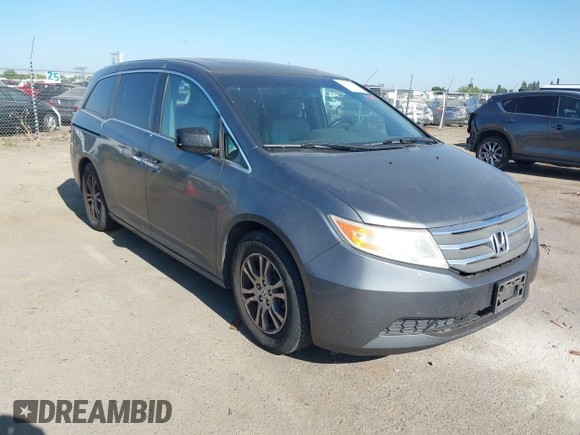 2012 Honda Odyssey EX-L with VIN 5FNRL5H6XCB061026, listed as a IAAI auction lot 42574612 with 144,480 mi miles and . Bid and sale history available at DreamBid. Image 1.