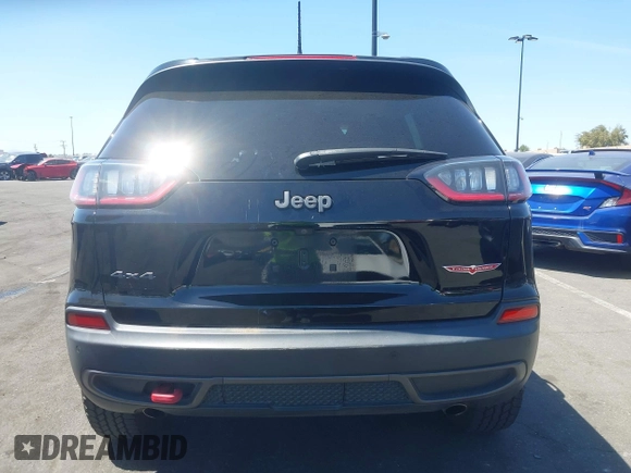 2019 Jeep Cherokee Trailhawk with VIN 1C4PJMBXXKD433284, listed as a IAAI auction lot 42020051 with 57,089 mi miles and . Bid and sale history available at DreamBid. Image 17.