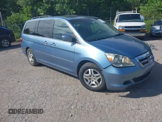 2005 Honda Odyssey EX-L with VIN 5FNRL38795B113570, listed as a IAAI auction lot 42601223 with 239,391 mi miles and . Bid and sale history available at DreamBid. Image 1.