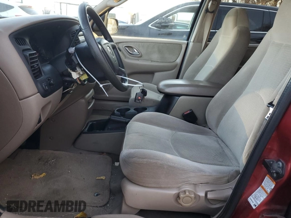2001 Mazda Tribute LX with VIN 4F2CU08111KM19933, listed as a Copart auction lot 81174614 with 209,736 mi miles and Salvage Title. Bid and sale history available at DreamBid. Image 7.