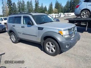 2007 Dodge Nitro SXT with VIN 1D8GU28K87W581969, listed as a IAAI auction lot 42036088 with 128,382 mi miles. Bid and sale history available at carsss.com. Image 1.