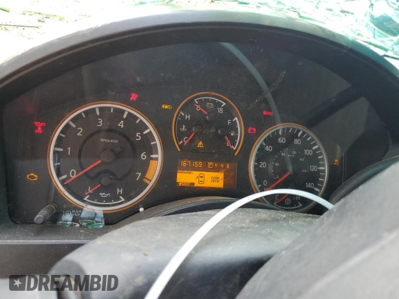 2012 Nissan Titan S z VIN 1N6AA0CJ9CN325160, wystawiony jako Copart lot #70004034 z przebiegiem 167 159 mil mil oraz Szkoda całkowita • Salvage title. Historia ofert i sprzedaży dostępna na DreamBid. Obrazek 9.