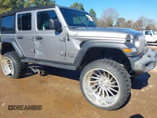 2019 Jeep Wrangler Unlimited Sport S z VIN 1C4HJXDN4KW599466, wystawiony jako IAAI lot #41407578 z przebiegiem 77 312 mil mil oraz . Historia ofert i sprzedaży dostępna na DreamBid. Obrazek 1.