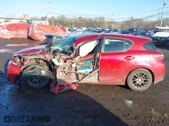 2012 Lexus CT 200h z VIN JTHKD5BH6C2094597, wystawiony jako IAAI lot #41519462 z przebiegiem 100 783 mil mil oraz . Historia ofert i sprzedaży dostępna na DreamBid. Obrazek 14.