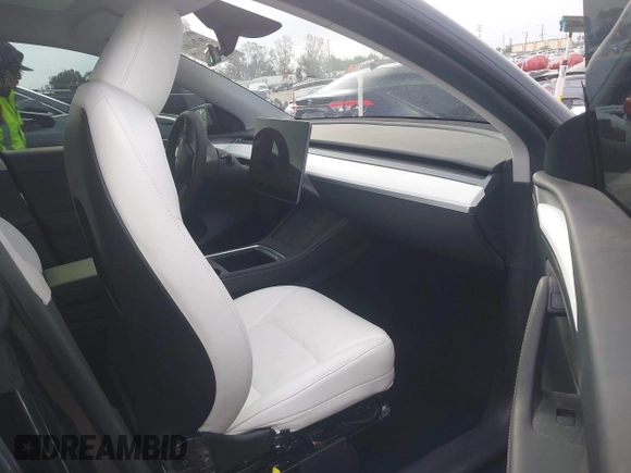 2024 Tesla Model Y with VIN 7SAYGDED8RF116209, listed as a IAAI auction lot 41761804 with 12,048 mi miles and . Bid and sale history available at DreamBid. Image 5.