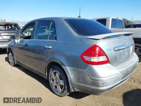 2007 Nissan Versa 1.8 SL with VIN 3N1BC11E37L432291, listed as a IAAI auction lot 41357144 with 136,039 mi miles. Bid and sale history available at carsss.com. Image 3.