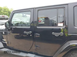 2015 Jeep Wrangler Unlimited Sahara with VIN 1C4HJWEG3FL661568, listed as a IAAI auction lot 42387810 with 140,927 mi miles and . Bid and sale history available at DreamBid. Image 14.