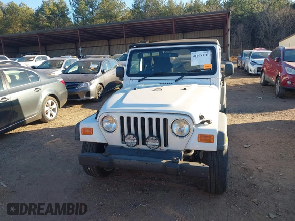 2004 Jeep Wrangler Sport Right Hand Drive with VIN 1J4F449S74P732854, listed as a IAAI auction lot 41408316 with 112,064 mi miles. Bid and sale history available at carsss.com. Image 12.