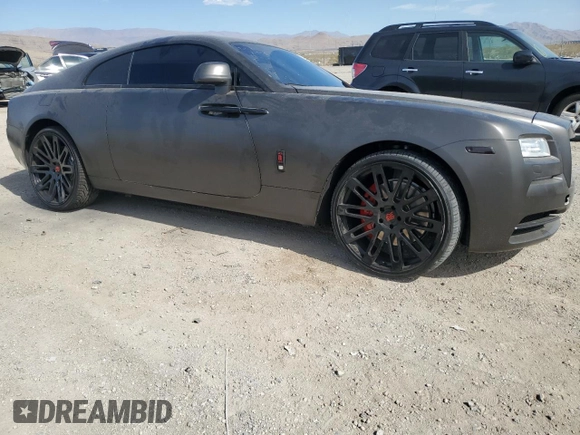 2014 Rolls-Royce Wraith z VIN SCA665C57EUX84259, wystawiony jako Copart lot #65586204 z przebiegiem 52 048 mil mil oraz Szkody całkowita. Historia ofert i sprzedaży dostępna na DreamBid. Obrazek 4.