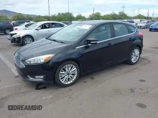2017 Ford Focus Titanium z VIN 1FADP3N24HL326330, wystawiony jako IAAI lot #42594927 z przebiegiem 54 727 mil mil oraz . Historia ofert i sprzedaży dostępna na DreamBid. Obrazek 17.