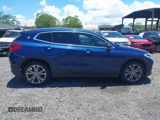 2020 BMW X2 sDrive28i with VIN WBXYH9C05L5P25132, listed as a IAAI auction lot 42269935 with 55,508 mi miles and . Bid and sale history available at DreamBid. Image 13.