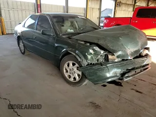 2001 Toyota Camry LE z VIN JT2BF22K510303027, wystawiony jako Copart lot #85090174 z przebiegiem 253 038 mil mil oraz Szkoda całkowita • Salvage title. Historia ofert i sprzedaży dostępna na DreamBid. Obrazek 11.