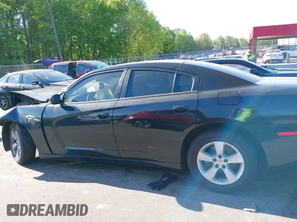 2012 Dodge Charger SE with VIN 2C3CDXBG7CH259867, listed as a IAAI auction lot 42046084 with 240,558 mi miles and . Bid and sale history available at DreamBid. Image 13.