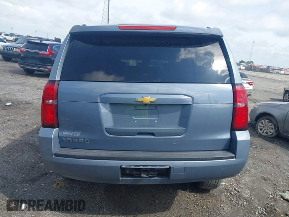2016 Chevrolet Tahoe LT with VIN 1GNSCBKC2GR257077, listed as a IAAI auction lot 42091171 with 118,660 mi miles and . Bid and sale history available at DreamBid. Image 16.