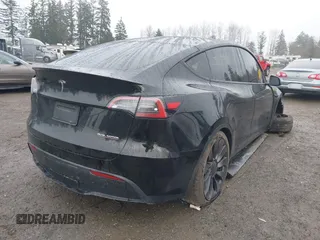2021 Tesla Model Y Performance z VIN 5YJYGDEF2MF215938, wystawiony jako IAAI lot #41338287 z przebiegiem 63 925 mil mil oraz . Historia ofert i sprzedaży dostępna na DreamBid. Obrazek 4.