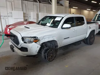 2018 Toyota Tacoma SR with VIN 3TMCZ5AN0JM164924, listed as a IAAI auction lot 41754508 with 59,038 mi miles. Bid and sale history available at carsss.com. Image 2.