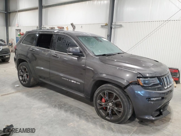 2015 Jeep Grand Cherokee SRT with VIN 1C4RJFDJ8FC752210, listed as a Copart auction lot 88773005 with 76,721 mi miles and Salvage Title. Bid and sale history available at carsss.com. Image 4.