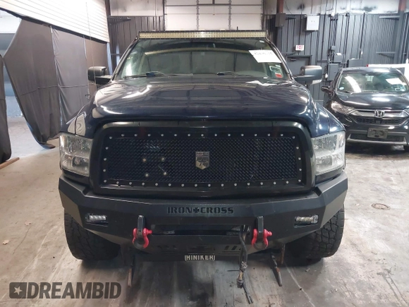2013 Ram 2500 SLT z VIN 3C6TR5JT1DG566895, wystawiony jako IAAI lot #42096955 z przebiegiem 168 454 mil mil oraz . Historia ofert i sprzedaży dostępna na DreamBid. Obrazek 12.