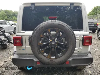 2024 Jeep Wrangler Sahara with VIN 1C4RJXP65RW210689, listed as a Copart auction lot 66482724 with 4,872 mi miles and Salvage Title. Bid and sale history available at DreamBid. Image 6.