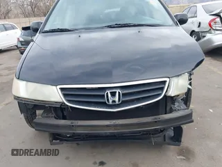 2004 Honda Odyssey EX-L with VIN 5FNRL18914B037976, listed as a IAAI auction lot 41893438 with Not Provided miles and . Bid and sale history available at DreamBid. Image 6.