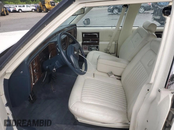 1992 Cadillac Brougham with VIN 1G6DW54E5NR708009, listed as a Copart auction lot 56849345 with 83,203 mi miles and Salvage title. Bid and sale history available at DreamBid. Image 7.
