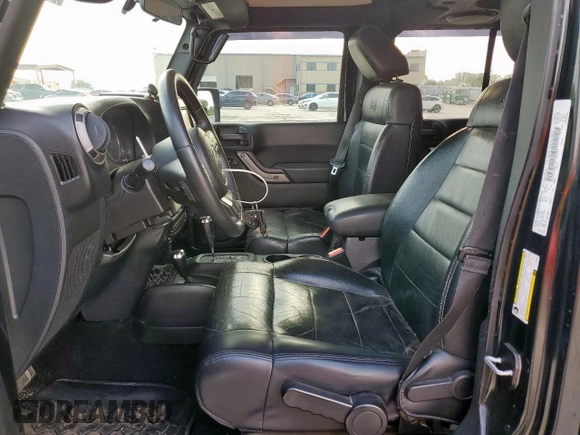 2012 Jeep Wrangler Unlimited Altitude with VIN 1C4HJWEGXCL180602, listed as a Copart auction lot 61391095 with 187,205 mi miles and Salvage title. Bid and sale history available at DreamBid. Image 7.