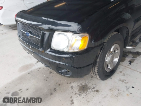 2004 Ford Explorer Sport Trac XLS z VIN 1FMZU77K94UA82414, wystawiony jako IAAI lot #42253012 z przebiegiem 202 018 mil mil oraz . Historia ofert i sprzedaży dostępna na DreamBid. Obrazek 6.